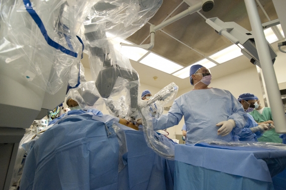 Drs. Belsley- Bhora and Connery preparing robot for thoracic surgery