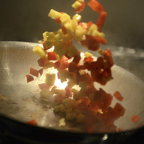 Grilled vegetables flipped out of a pan