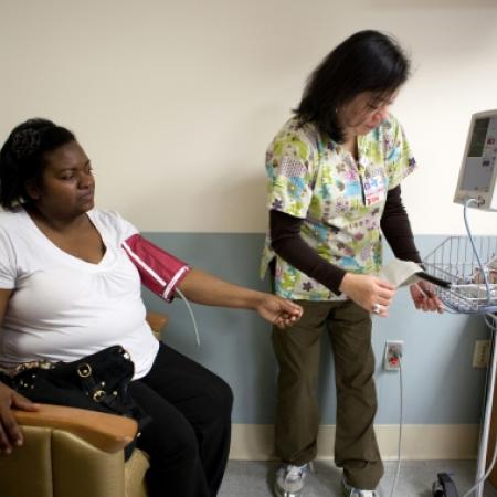 Bariatric patient being examined by nurse prior to operation