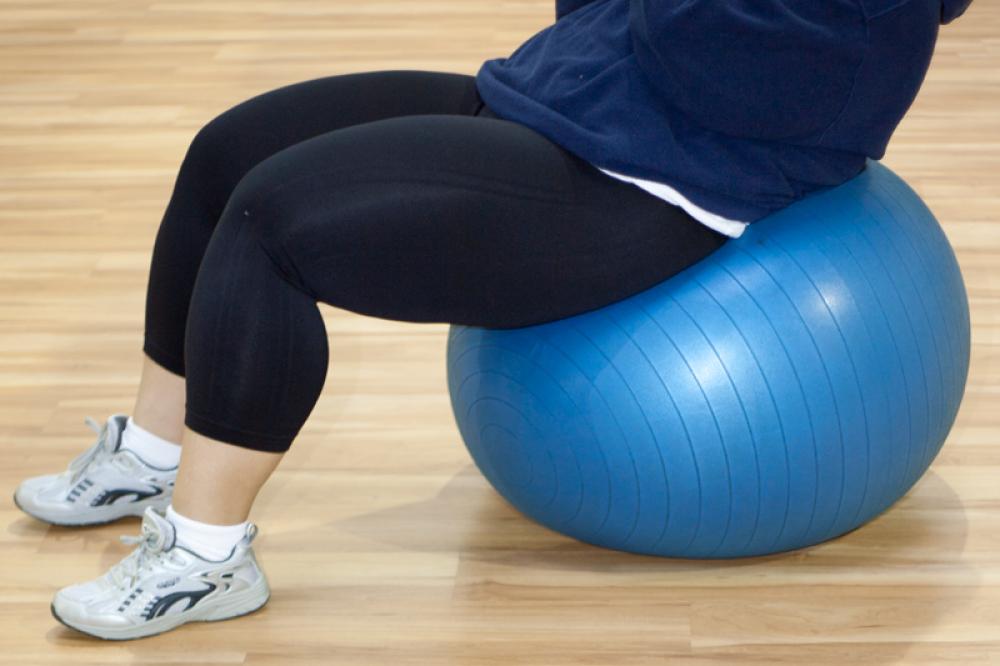 Exercising on Medicine Ball